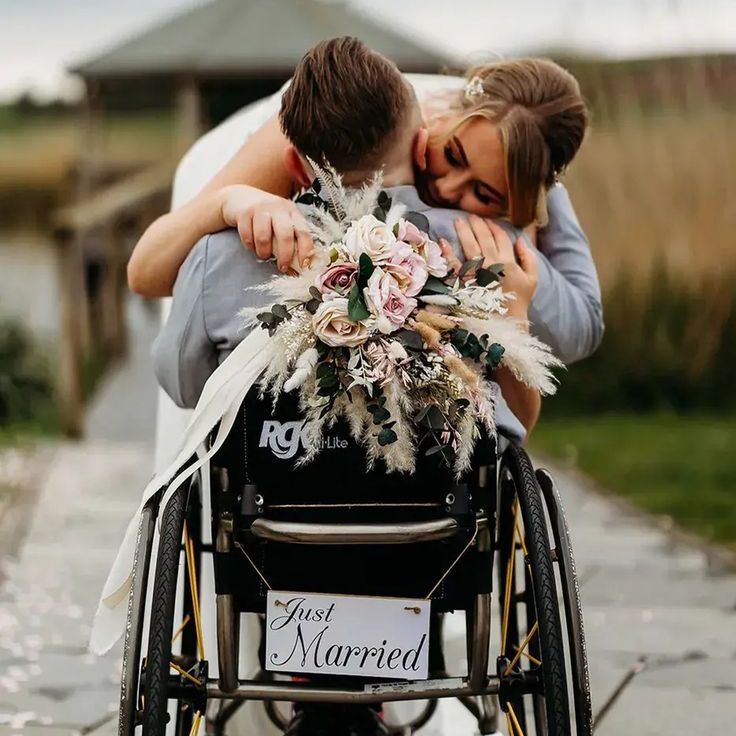 Groom in Wheelchair With Just Married Sign
