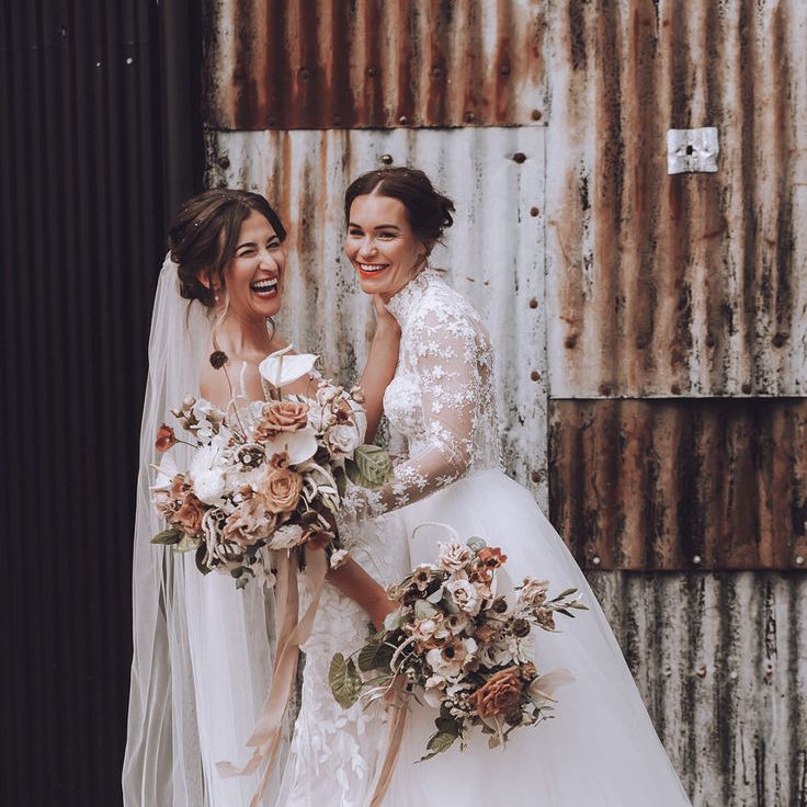 Same Sex Wedding with Two Brides in Flower Lace Wedding Dresses with Neutral Wedding Bouquet