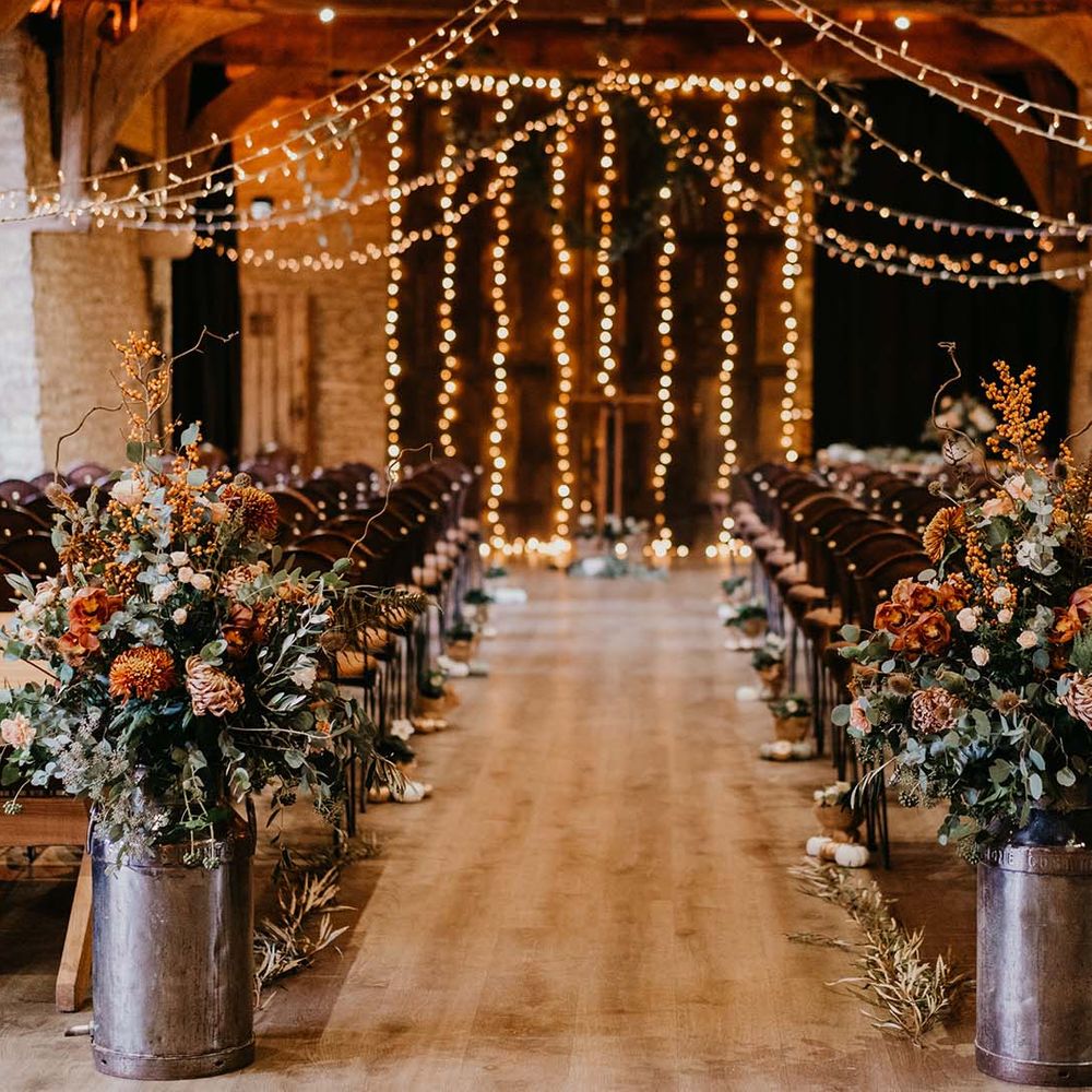 Tythe Barn wedding with fairy lights and cosy decor