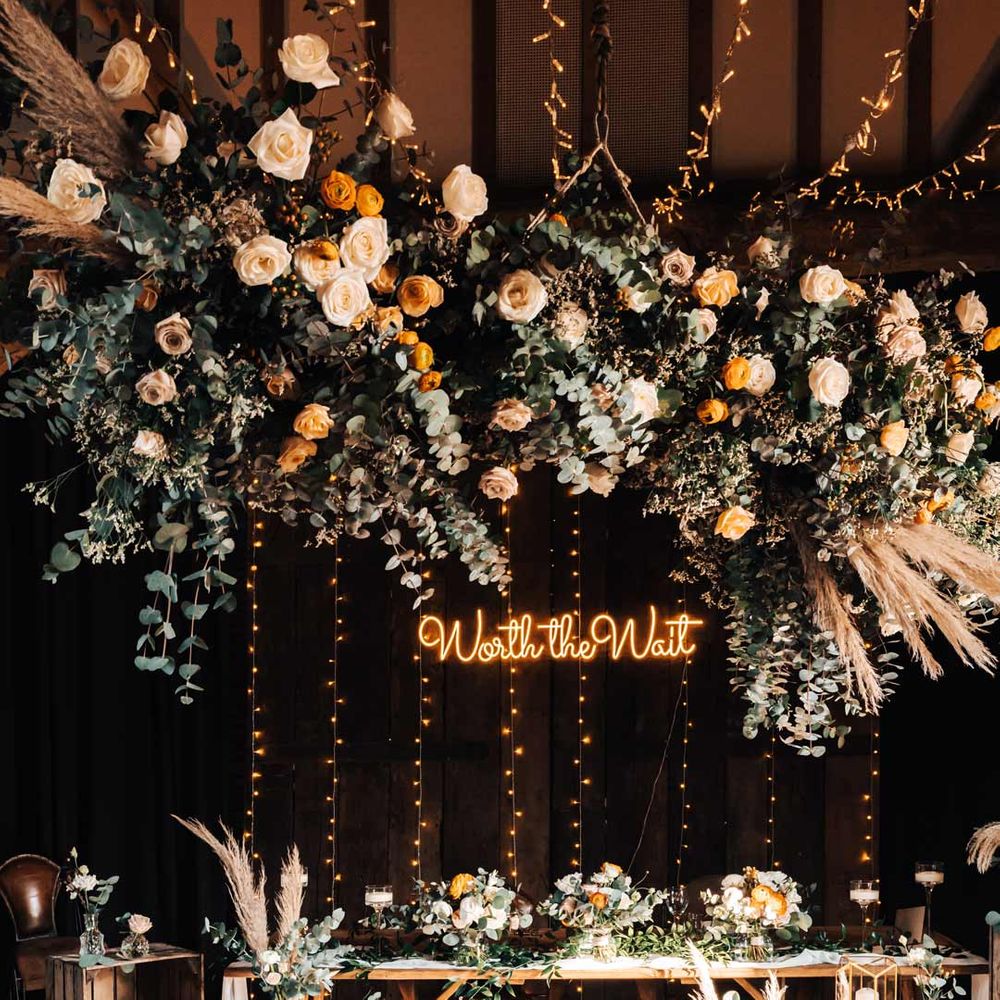 Hanging flower installations at wedding breakfast 