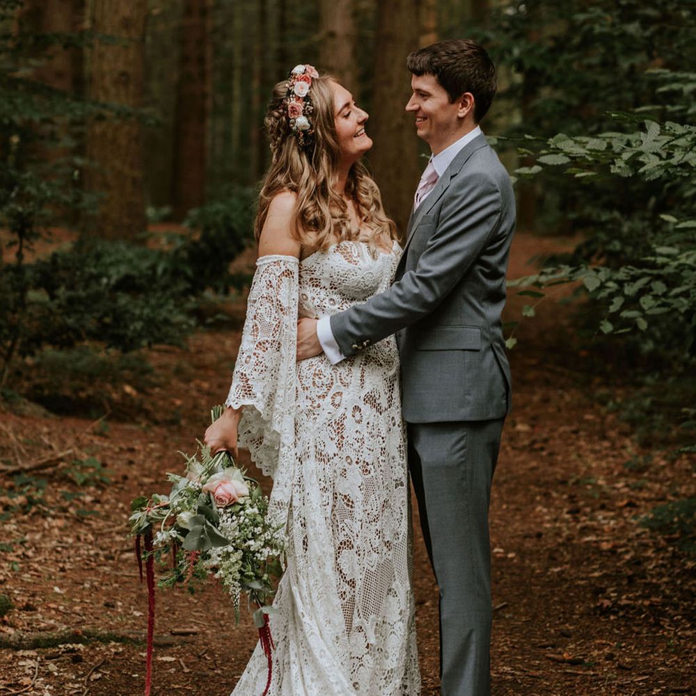 Bride in medieval inspired lace wedding dress with flower crown