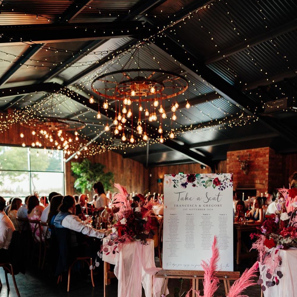 Pink pampas grass and dried wedding flower autumnal decor for barn wedding