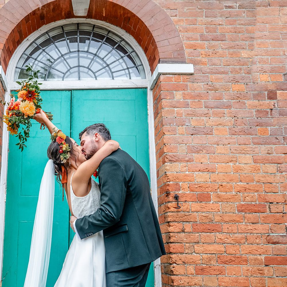 Kings Chapel Amersham couple kiss outside teal doorway