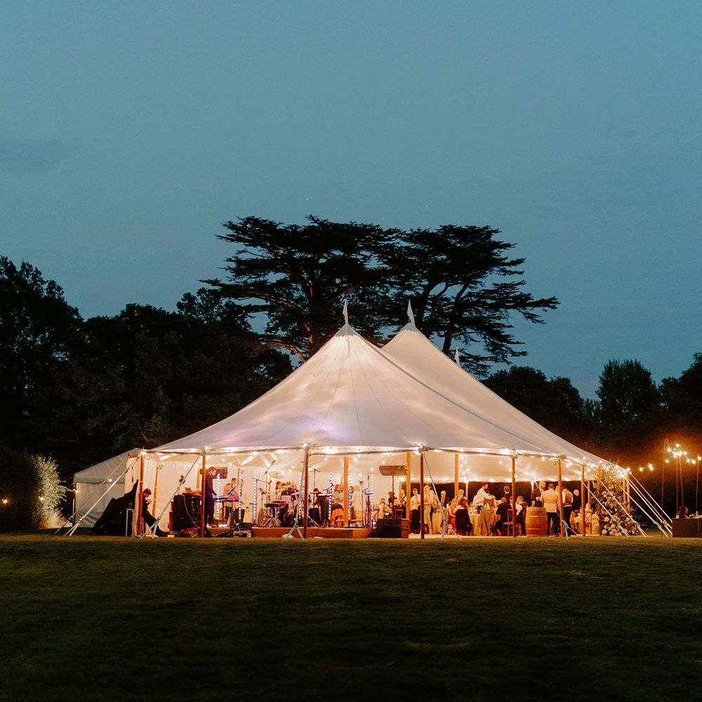 bignor park sussex weddings greek loggia formal gardens reception at night with band