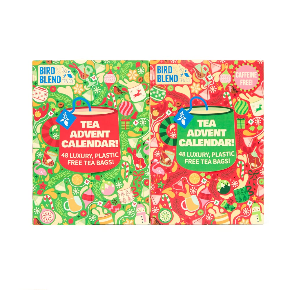 Two festive Bird & Blend tea advent calendars in green and red Christmas packaging side by side