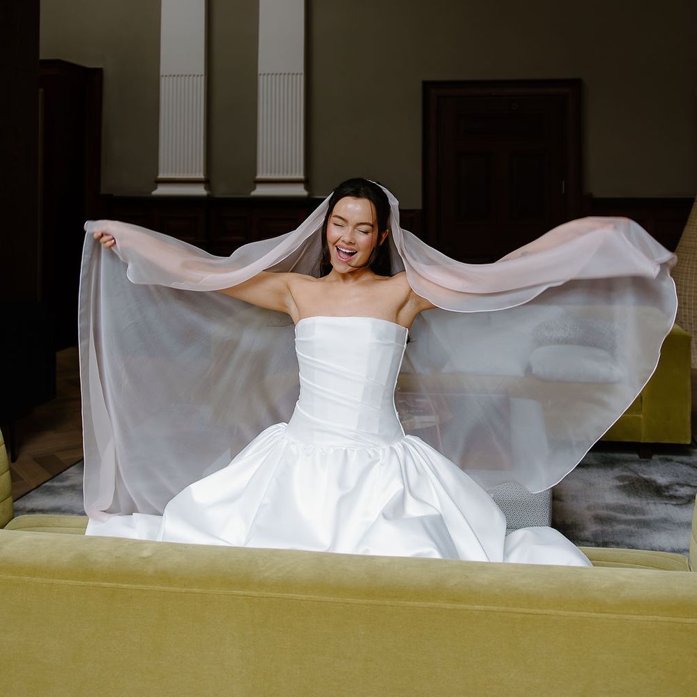 bride billowing veil chartreuse sofa