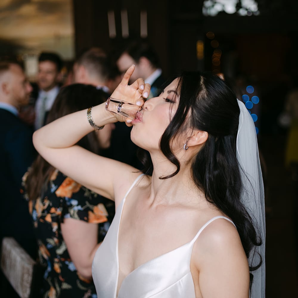 bride downing celebratory shot