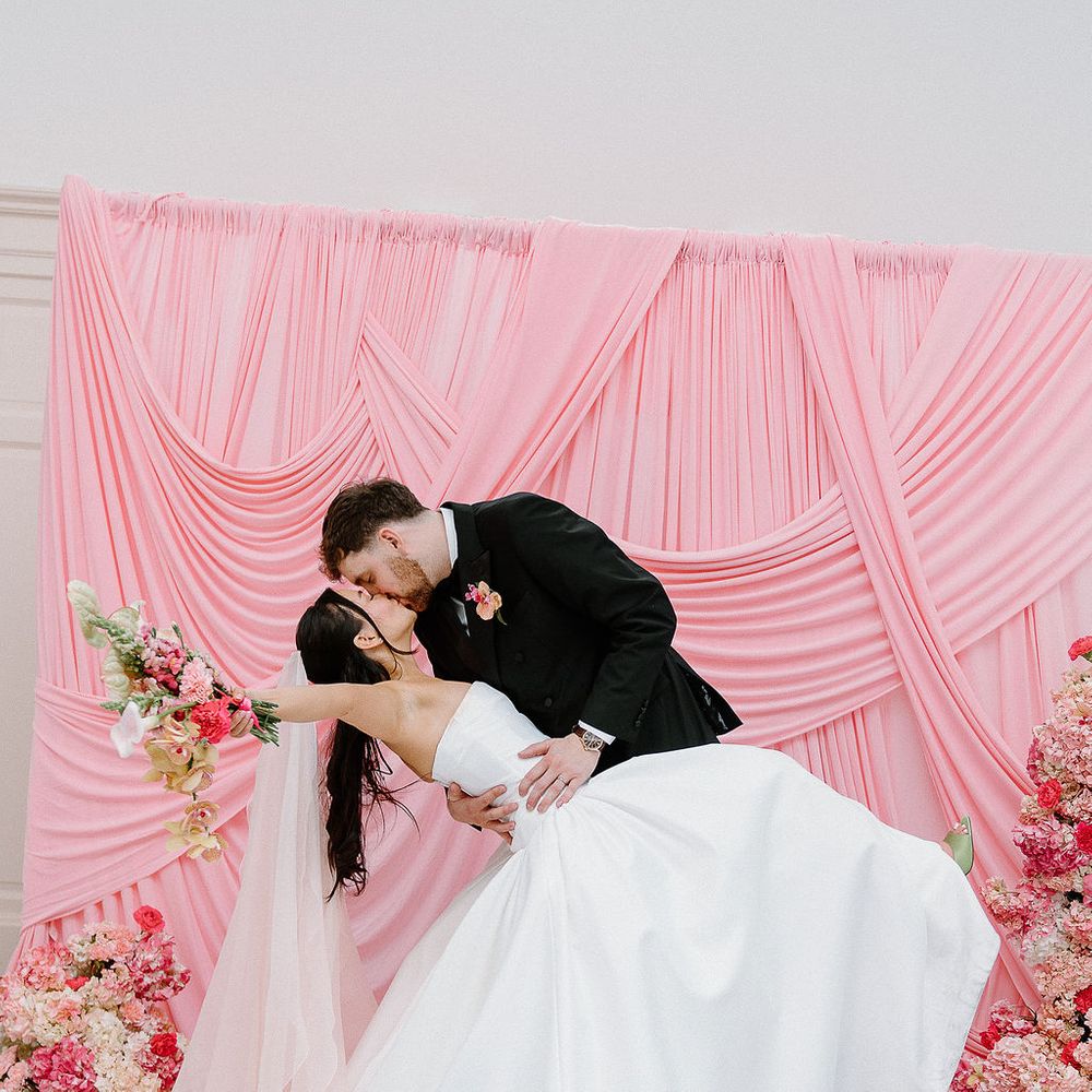 bride groom dip kiss drapery