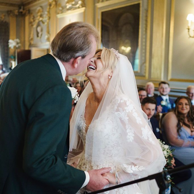 bride groom embrace ceremony laughter