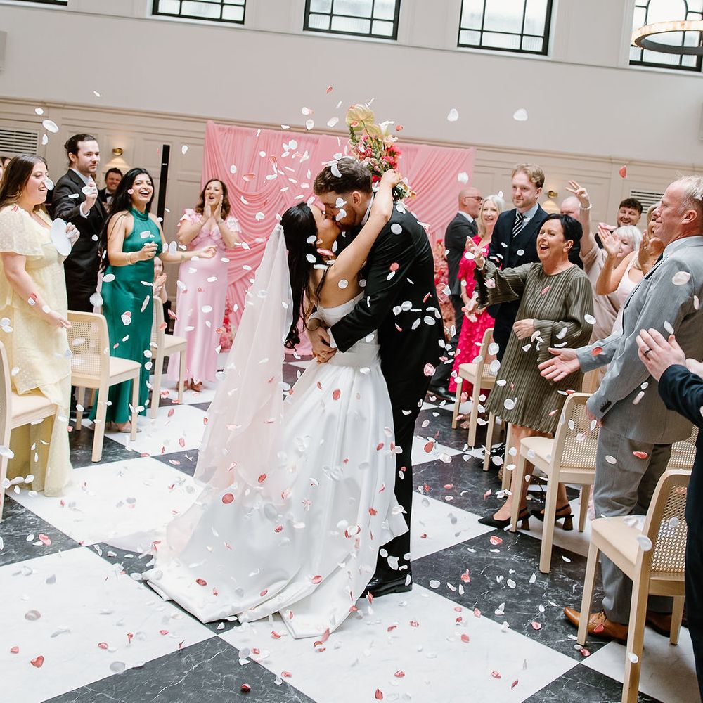 bride groom petal confetti kiss