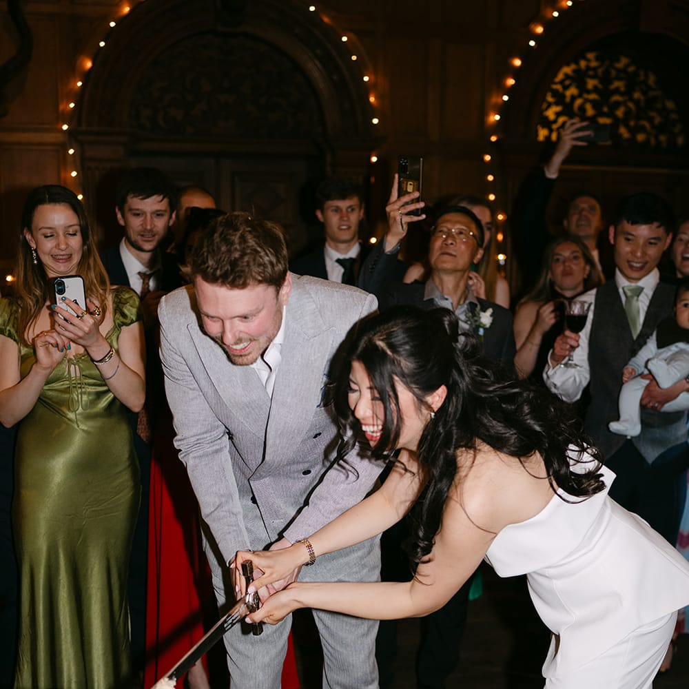 bride groom sword cake cutting