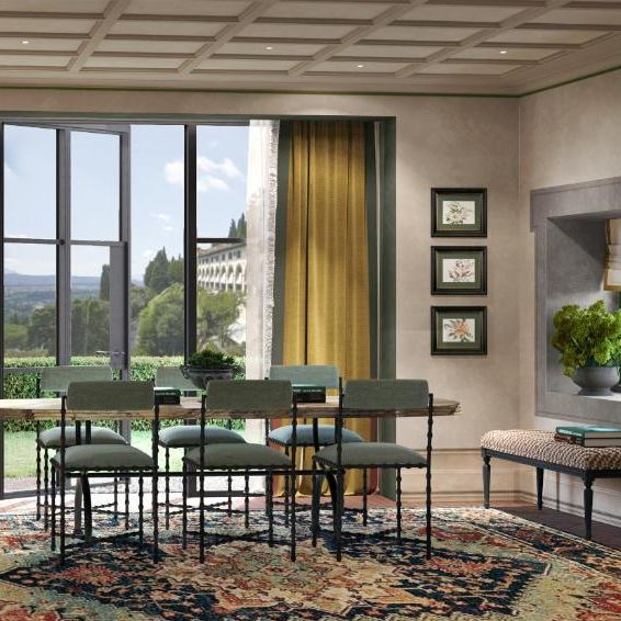 Elegant dining room with sage-green chairs, patterned rug and large windows overlooking gardens
