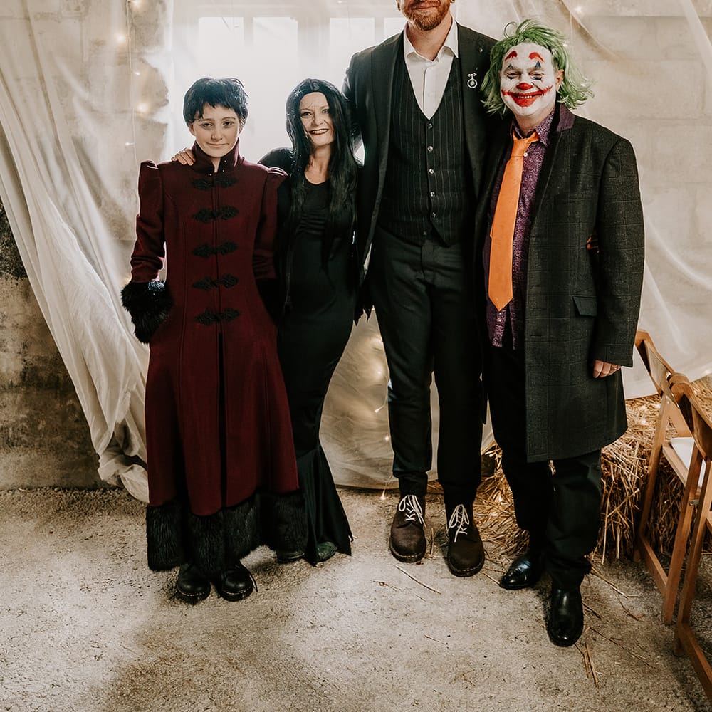 groom halloween costumed guests portrait