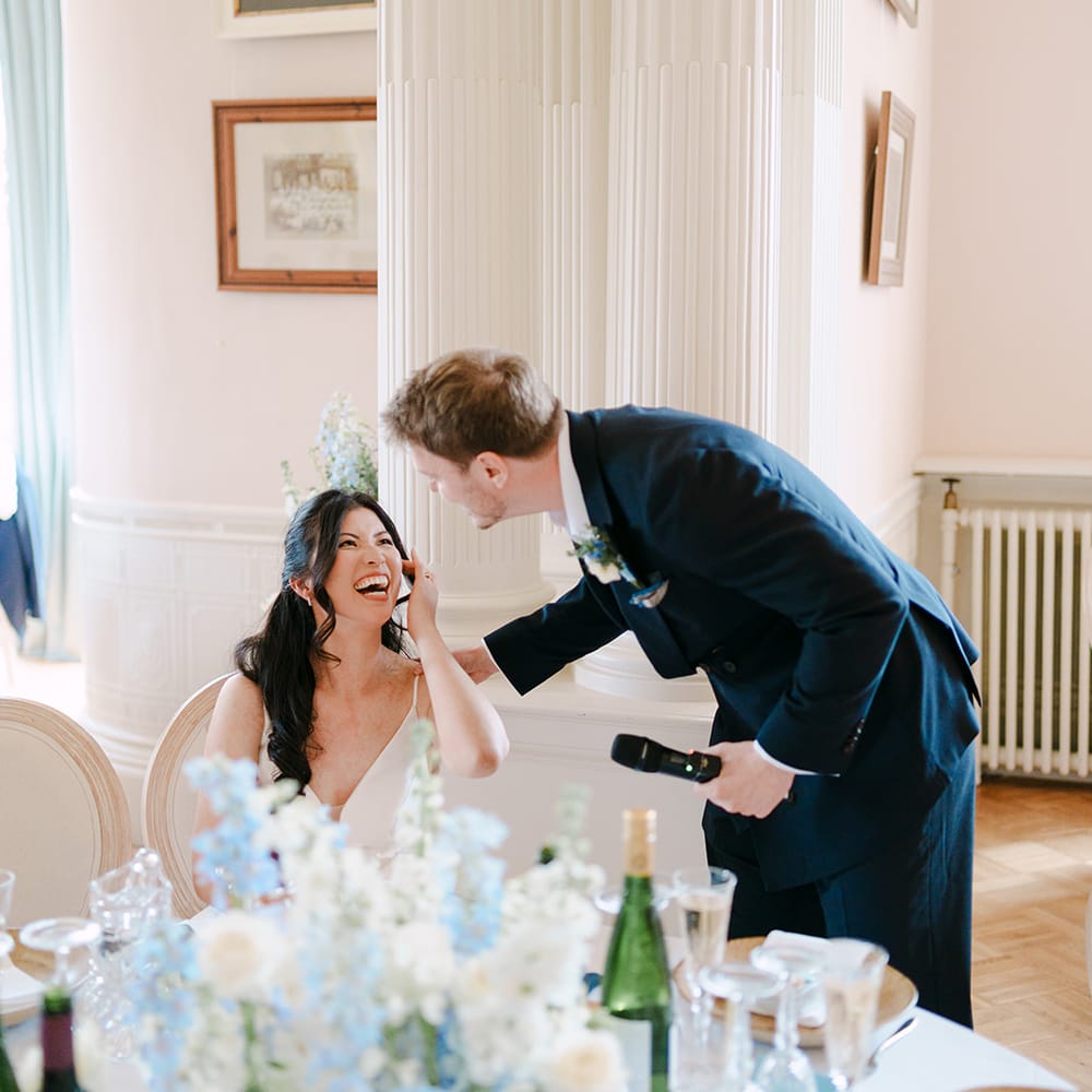 groom speech bride laughing