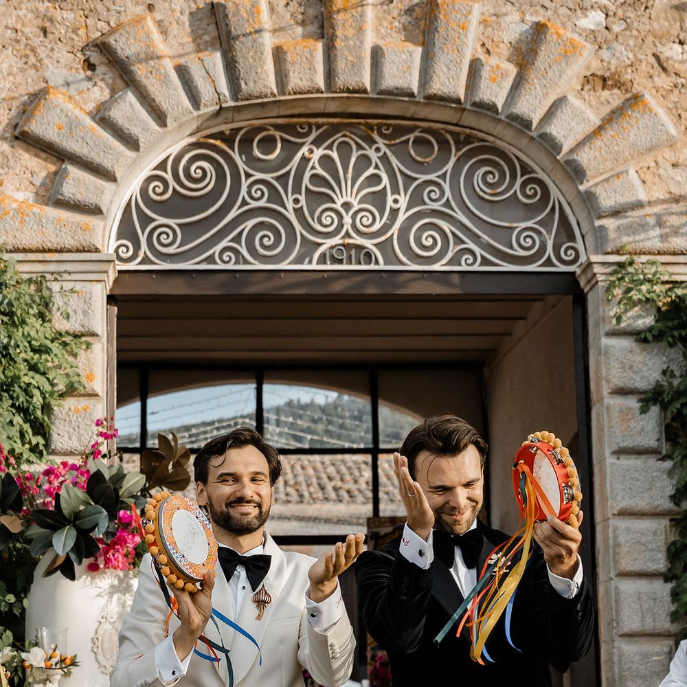 grooms tambourines stone archway