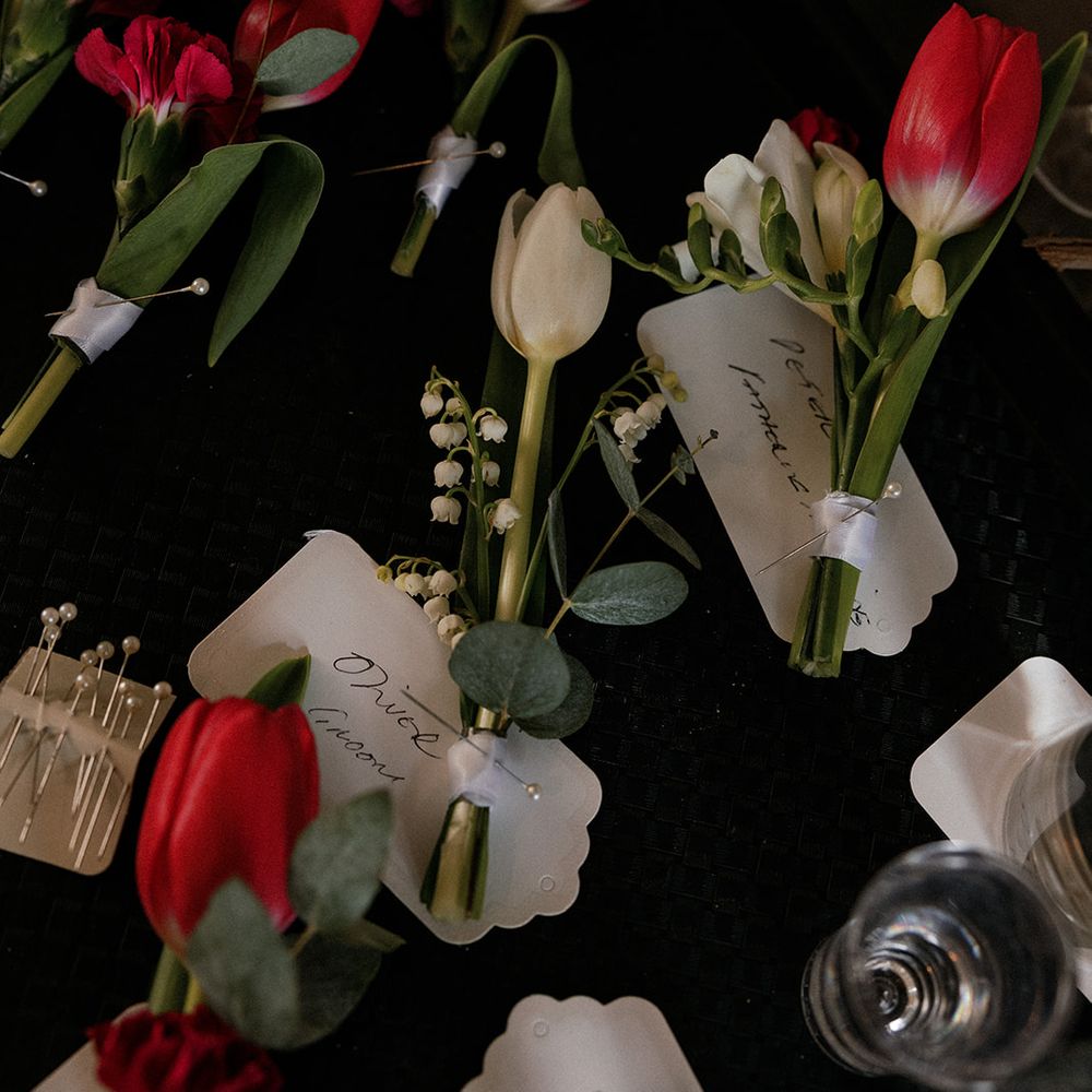 red tulip carnation boutonnieres