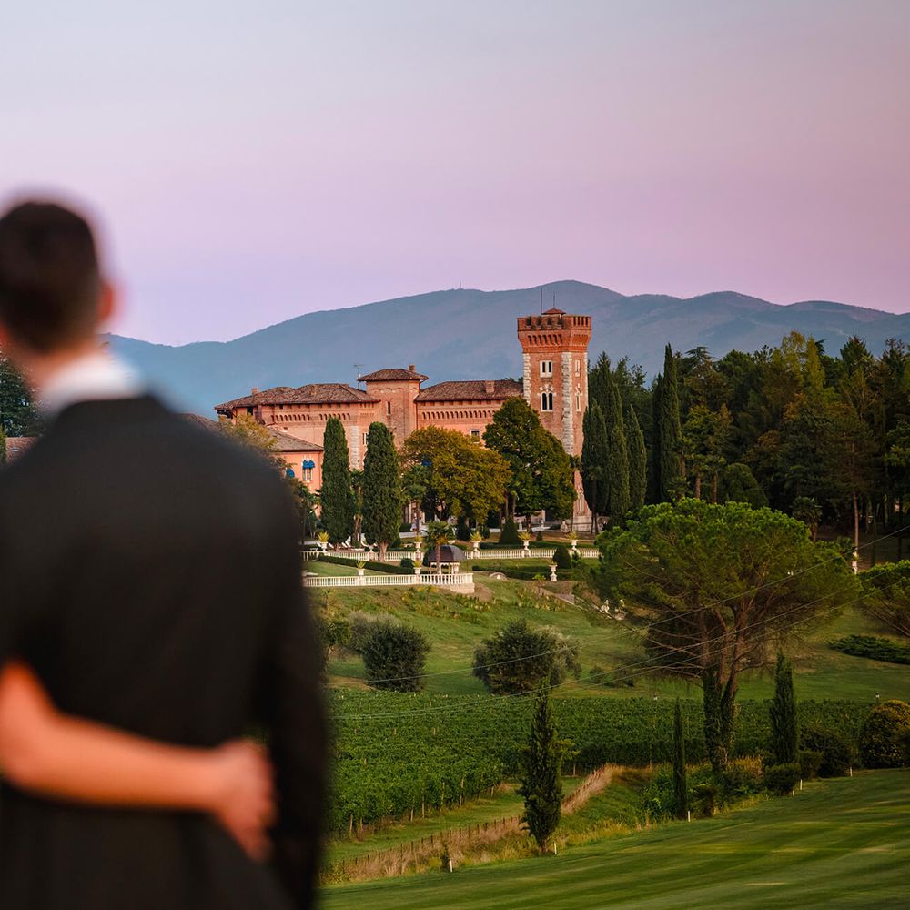 Couple looking at the landscape from Castello di Spessa in Friuli, Italy