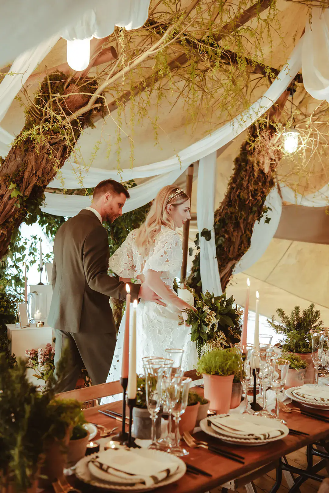 No waste wedding with beautiful botanical styling including foliage and white drapery for contemporary feel 