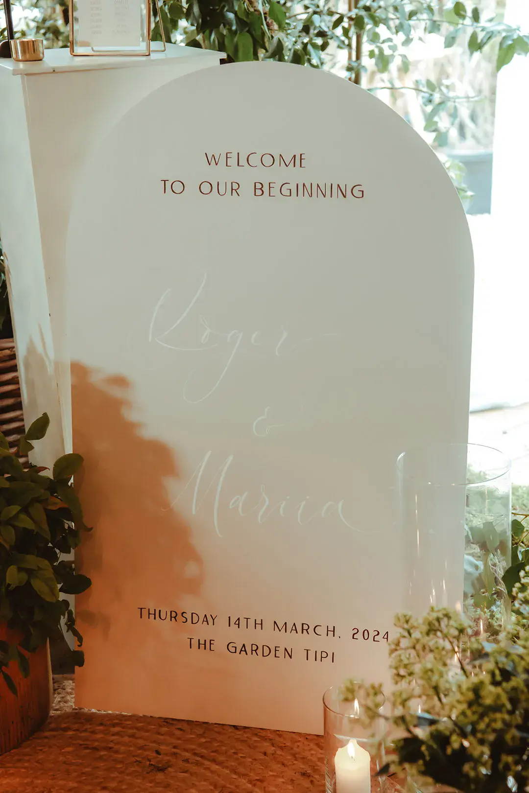 Ivory arched wedding welcome signage with wedding date 