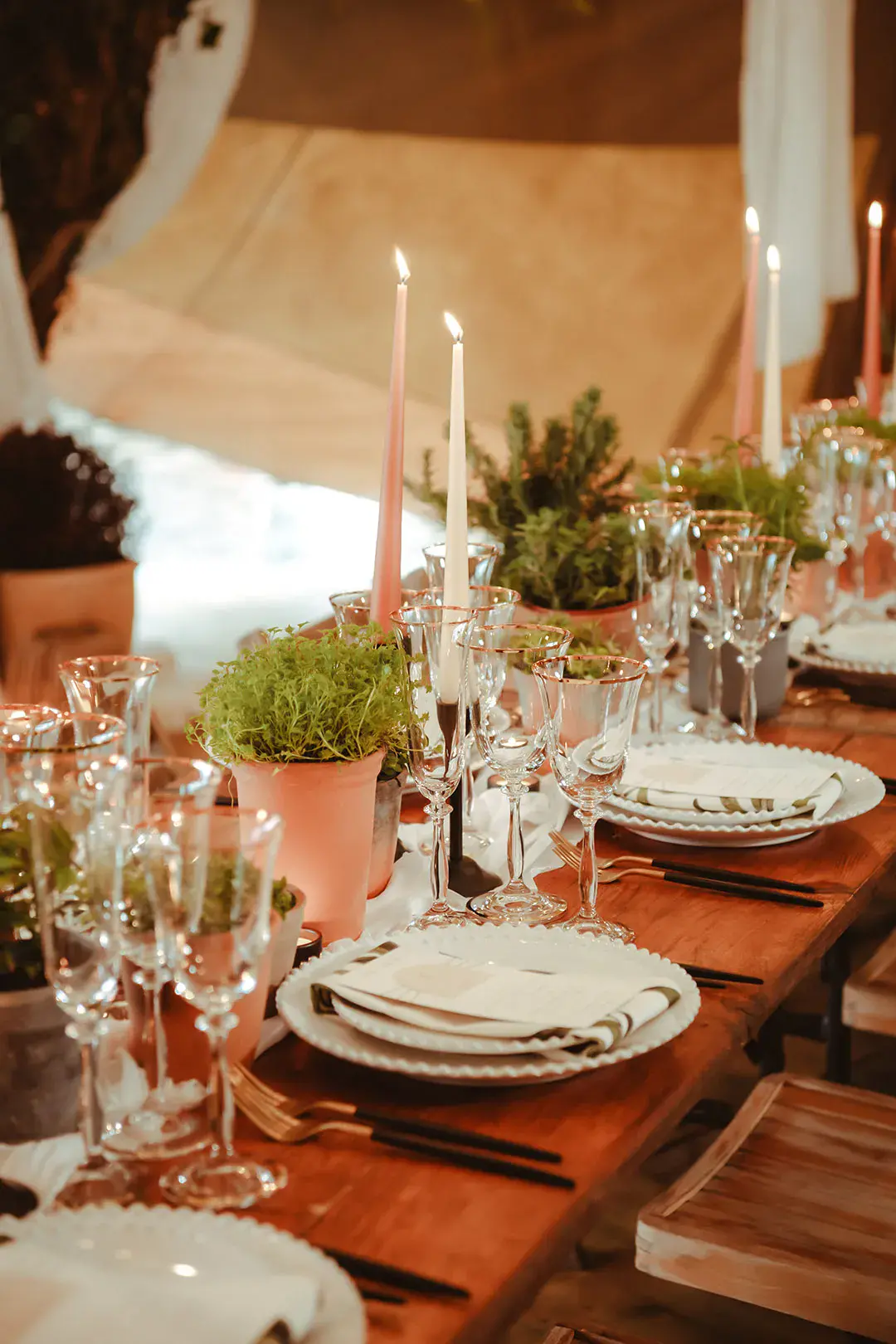 Simple minimalist wedding tablescape with grey and peach wedding taper candles and foliage decorations 