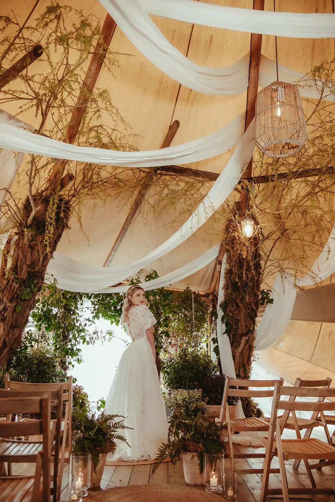 White drapery decorations with botanical foliage at sustainable wedding editorial shoot 