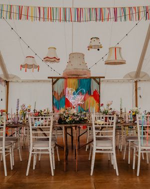 Hardwick Moat Weddings marquee with streamer decor and neon sign