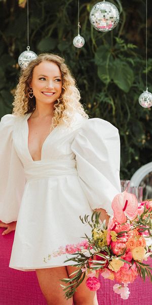 Polstrong Manor wedding with pink decor and bride in short puff sleeve wedding dress.