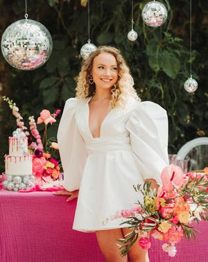 Polstrong Manor wedding with pink decor and bride in short puff sleeve wedding dress.