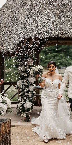 Bride and groom have confetti exit at The Orangery Kent.