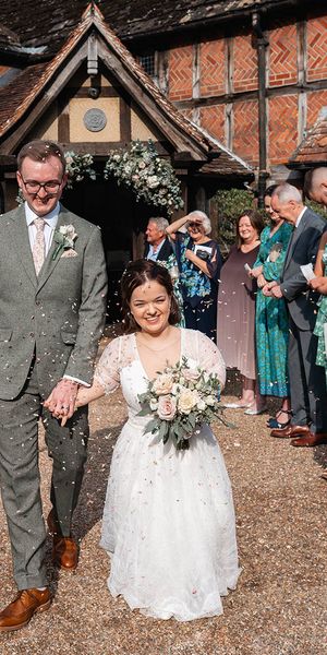 bride and groom have confetti exit at Langshott Manor in Surrey
