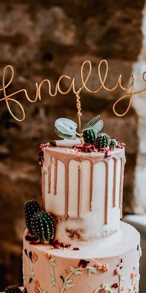 Unique wedding cake toppers including wire, laser-cut, figurines, and toys