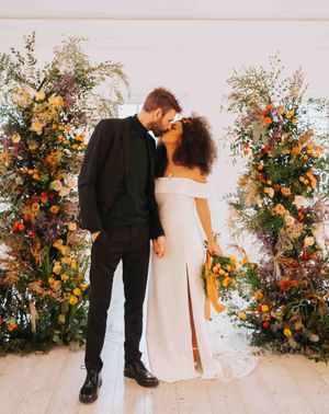 golden wedding inspiration with colour flowers, orange stationery and satin bridesmaid dresses