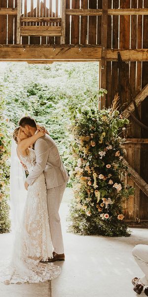 Bride and groom share their first kiss as a married couple at Nancarrow Farm.