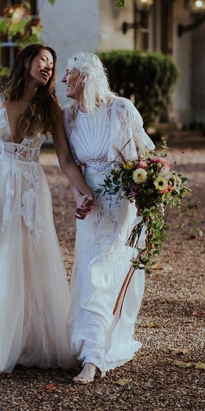 Aswarby Rectory wedding with two brides in boho lace wedding dresses