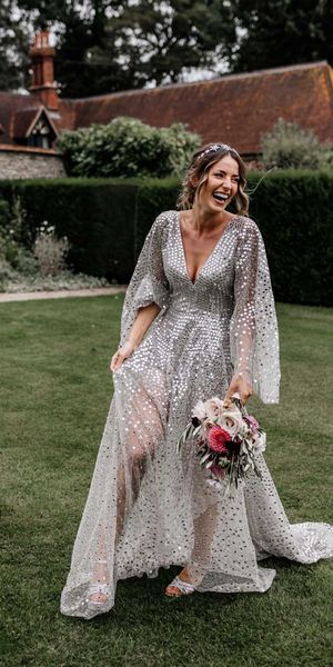 Silver sequin wedding dress, and gypsophila flower clouds for a marquee reception at home 