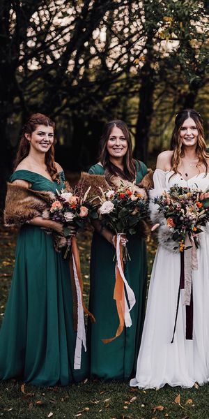 Forest green autumnal bridesmaid dresses for November wedding at Cripps Barn.
