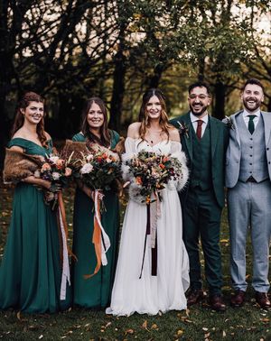 Forest green autumnal bridesmaid dresses for November wedding at Cripps Barn.