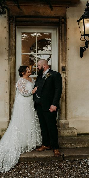 Groom in green tweed wedding suit with bride in lace dress at Aswarby Rectory.