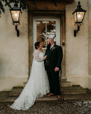 Groom in green tweed wedding suit with bride in lace dress at Aswarby Rectory.