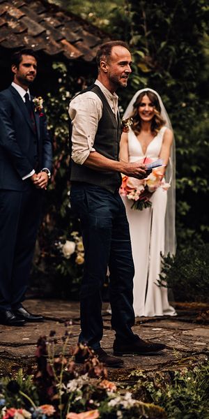 Guest gives a wedding reading from books.