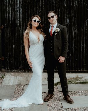 Bride in retro sunglasses with groom for wedding at Rhyse Farm.