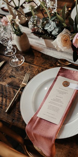 wedding menu card on pink napkin for place setting