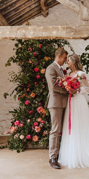 Bride in Sassi Holford wedding dress with the groom for rustic wedding.