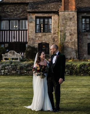 brinsop court manor house and barn wedding with smiling bride and groom.