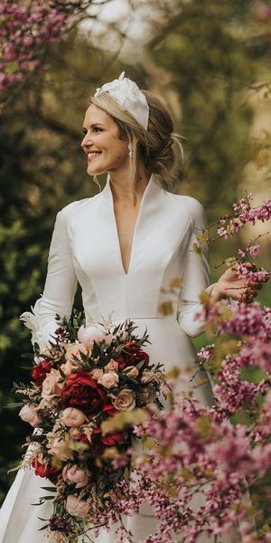 Bride in traditional wedding dress for classic Stowe House wedding.