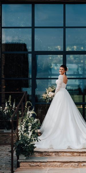 Bride in Emma Beaumont tulle princess wedding dress.
