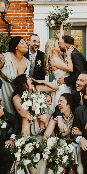 Villiers Barn wedding with the wedding party wearing green themed outfits