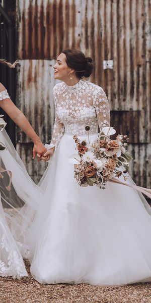 Stone Barn wedding with the brides in flower wedding dresses