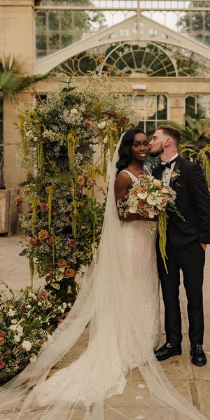 Syon Park wedding with black tie dress code, Nigerian money dance and flower columns