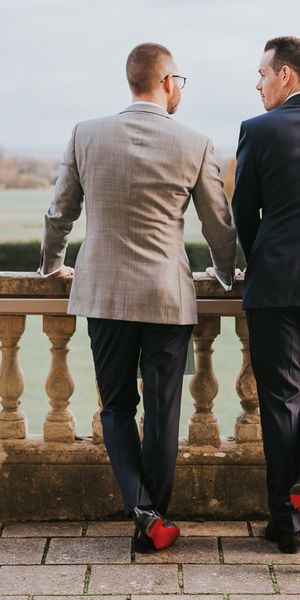 Louboutin groom shoes worn by two grooms for their country house gay wedding.